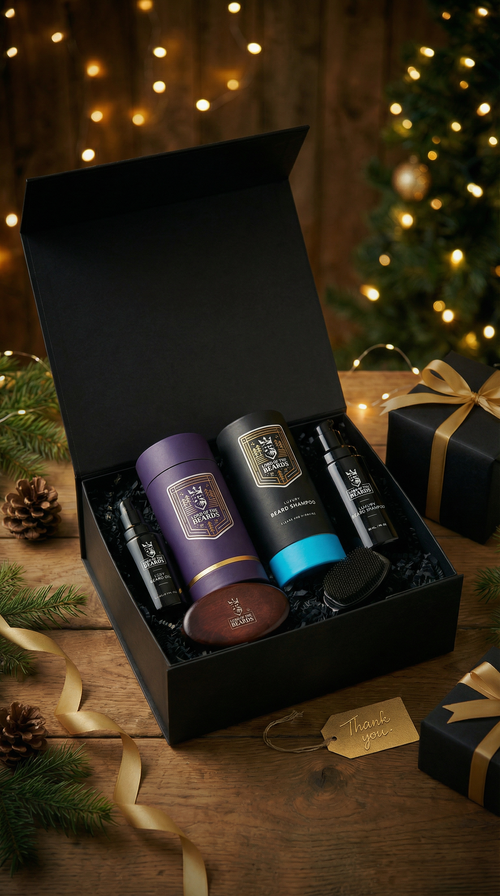 Gift set with three cylindrical containers in a black box, Christmas tree and decorations in the background.
